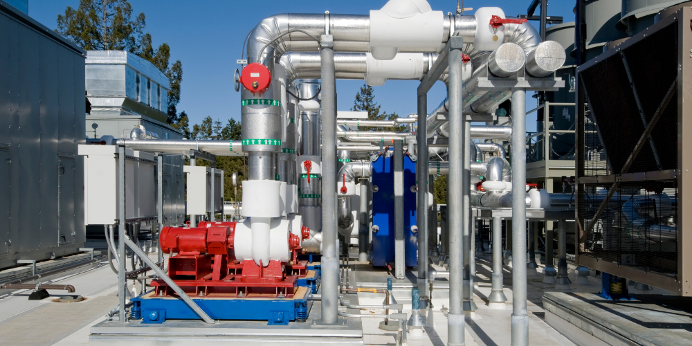 Complex HVAC System Installation in Scottsdale. Commercial rooftop equipment with pipes, pumps, and chillers for maintenance and repair.